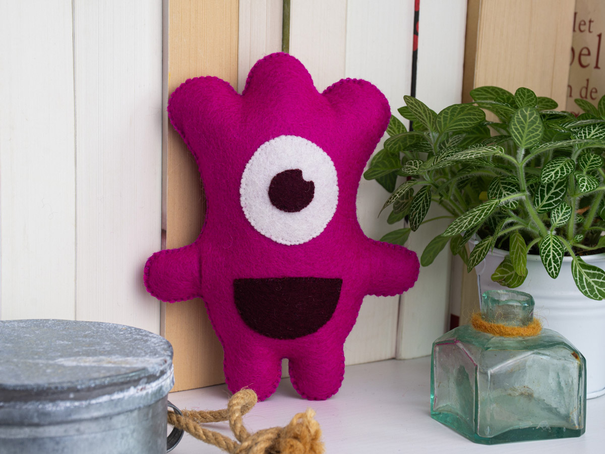 Image of a Happy Monster Club cuddly toy